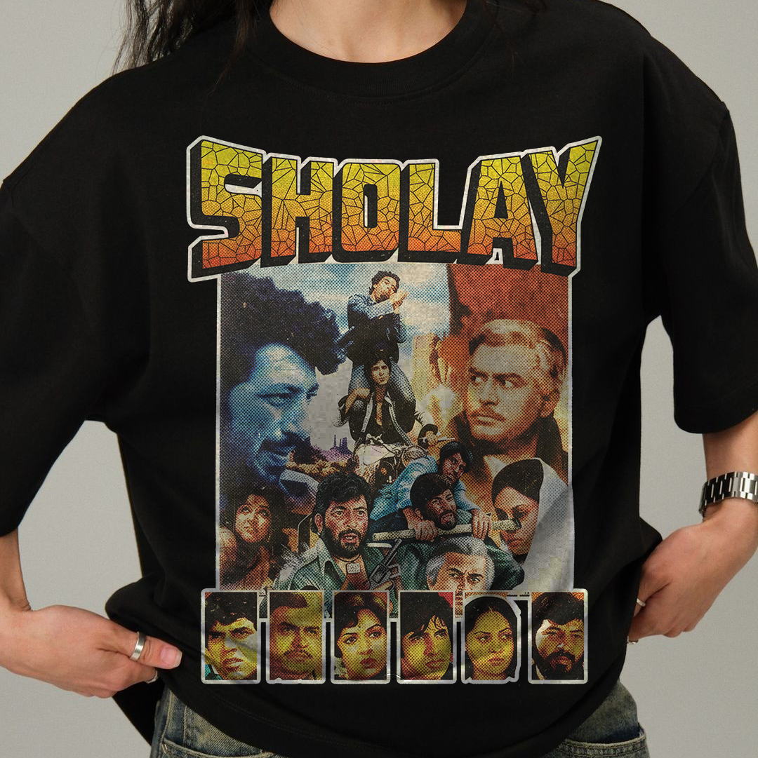 Person wearing a black t-shirt with 'Sholay' movie poster design.